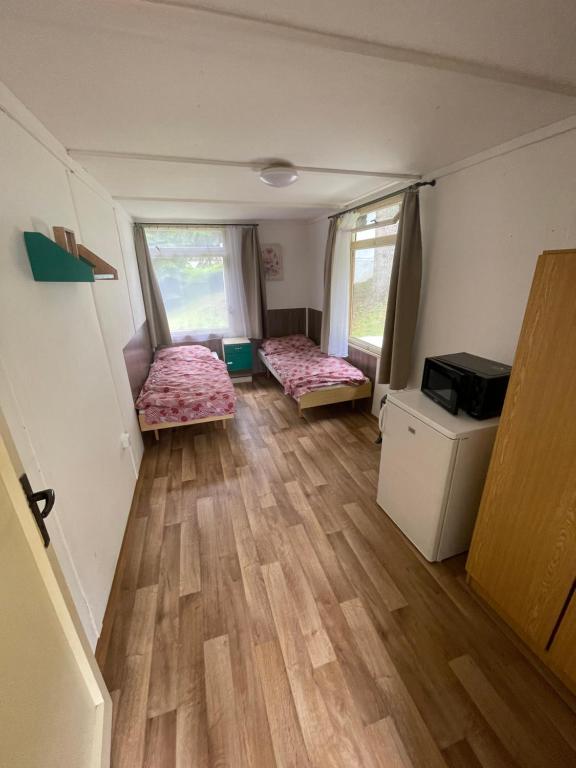 Postel nebo postele na pokoji v ubytování Chaty Kašperské Hory