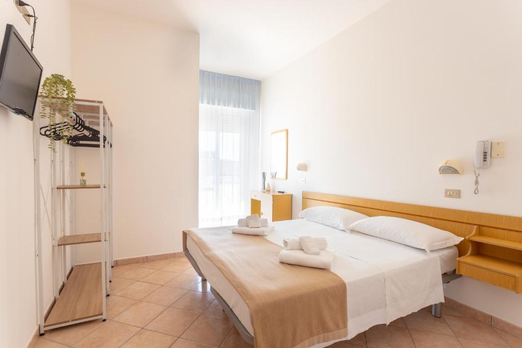 Postel nebo postele na pokoji v ubytování Hotel Katina