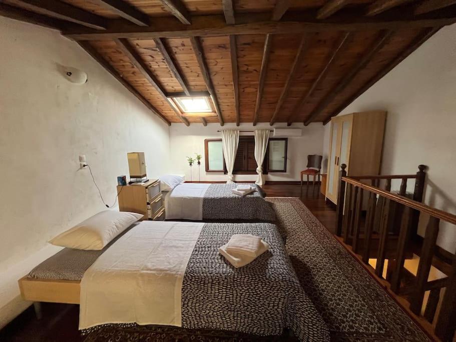 Postel nebo postele na pokoji v ubytování Argi's House Skiathos