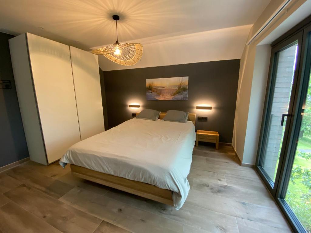 Postel nebo postele na pokoji v ubytování Gîte de la Tour