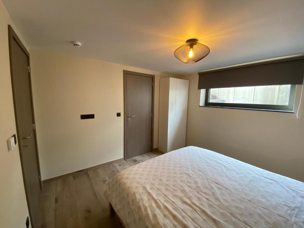 Postel nebo postele na pokoji v ubytování Gîte de la Tour