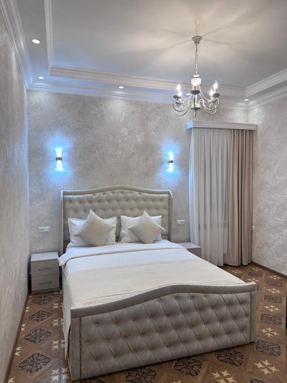 Postel nebo postele na pokoji v ubytování Royal Renaysance