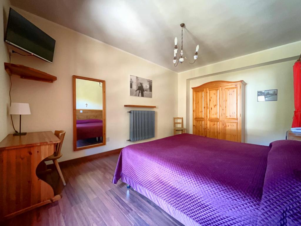 Postel nebo postele na pokoji v ubytování Hotel Garnì Mille Pini