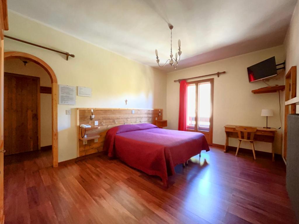 Postel nebo postele na pokoji v ubytování Hotel Garnì Mille Pini
