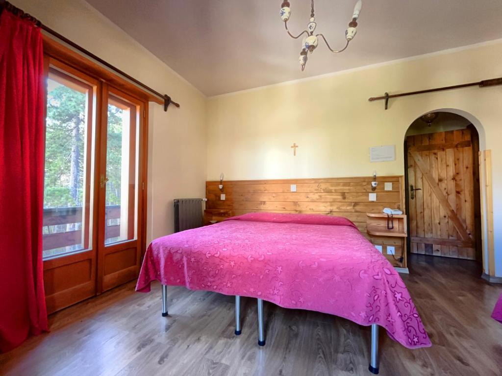 Postel nebo postele na pokoji v ubytování Hotel Garnì Mille Pini