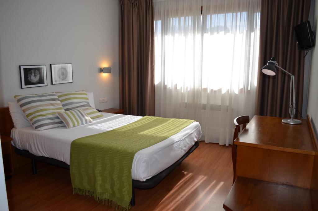 Postel nebo postele na pokoji v ubytování Hotel Elorrio