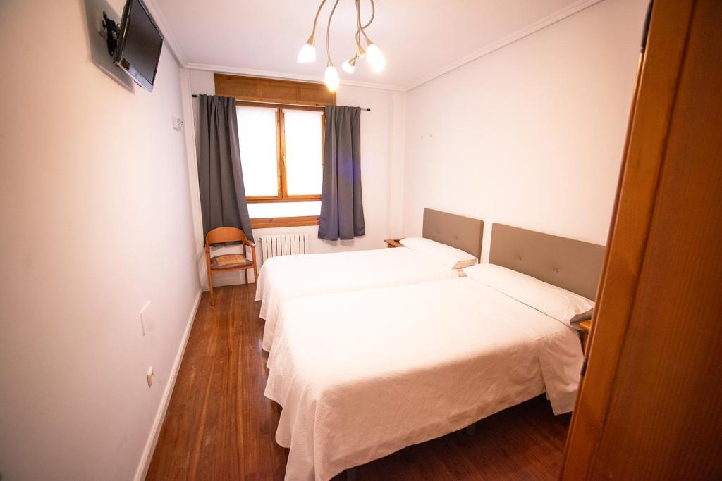 Postel nebo postele na pokoji v ubytování Apartacentro