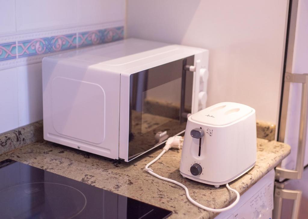 Kuchyň nebo kuchyňský kout v ubytování Apartacentro