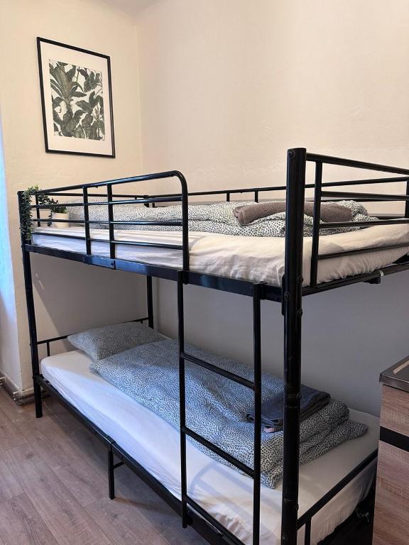 Postel nebo postele na pokoji v ubytování Black Style ROOMS Moravske namesti
