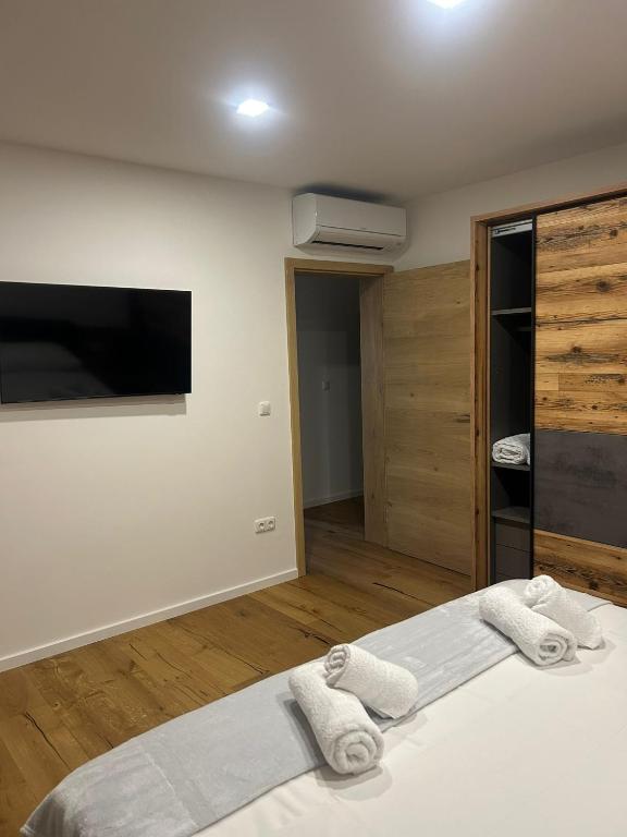 Postel nebo postele na pokoji v ubytování Apartmani Five