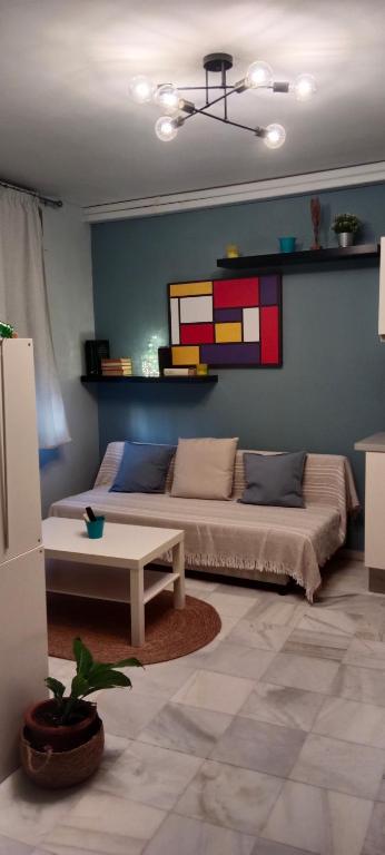 a living room with a couch and a table at Casa curro in Baena