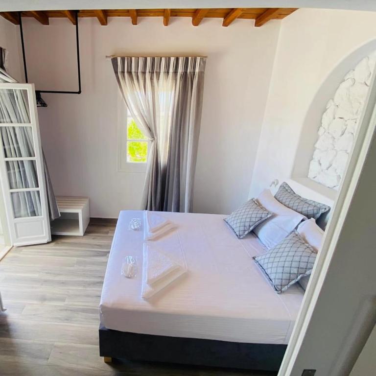 Postel nebo postele na pokoji v ubytování C Suites Mykonos