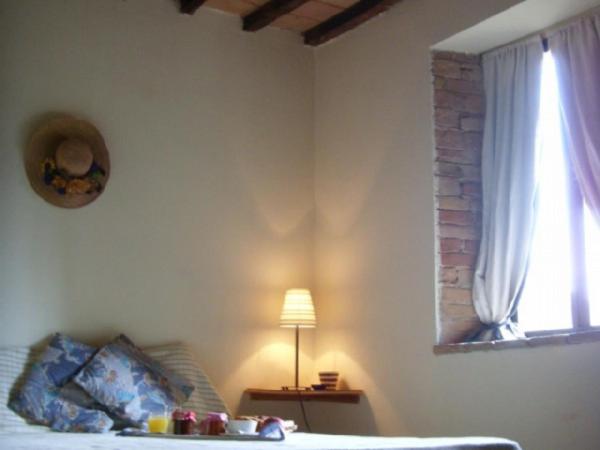 Postel nebo postele na pokoji v ubytování Agriturismo Le Vigne di Pace
