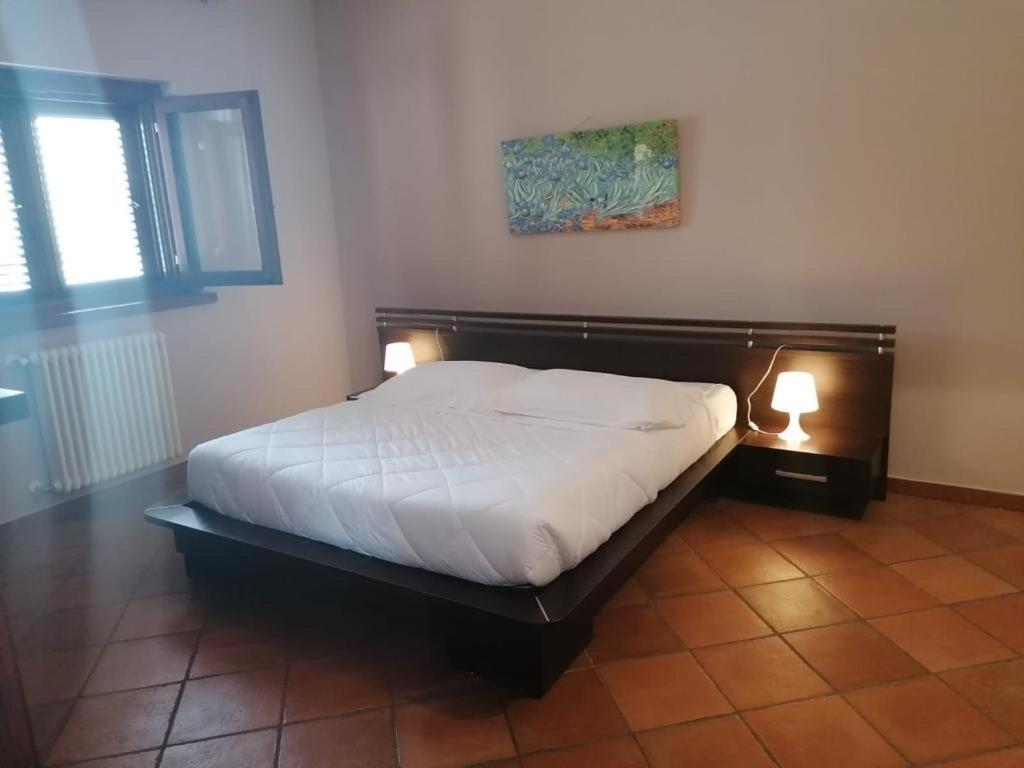 Postel nebo postele na pokoji v ubytování Maglioferro Residence