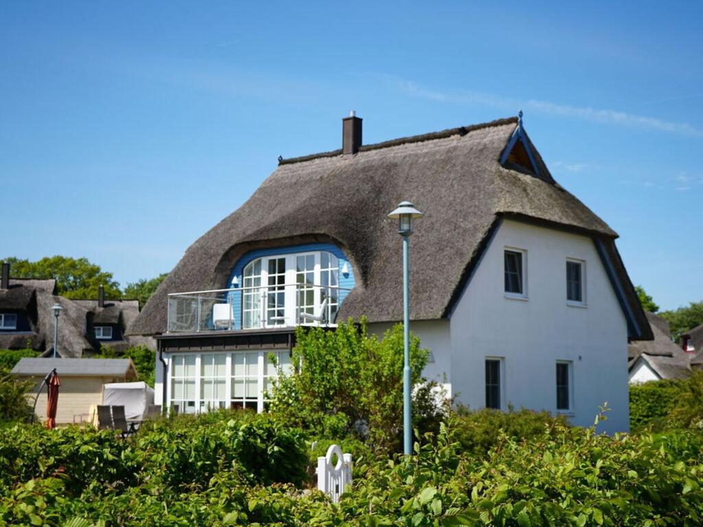 a house with a thatched roof at Blue Wonder Comfortable holiday residence in Zinnowitz