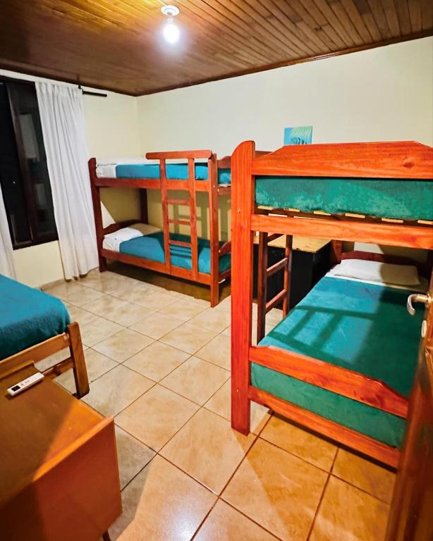 Postel nebo postele na pokoji v ubytování Benteveo hostel iguazu