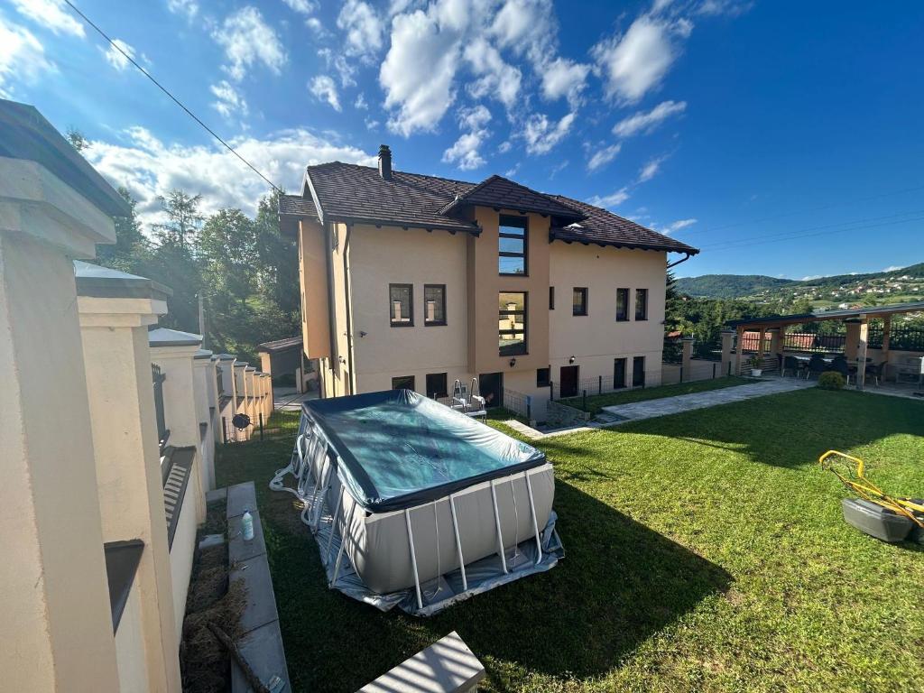 a swimming pool in the yard of a house at Vila Rakovica Ilidža Sarajevo in Sarajevo