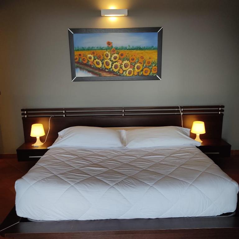 Postel nebo postele na pokoji v ubytování Maglioferro Residence