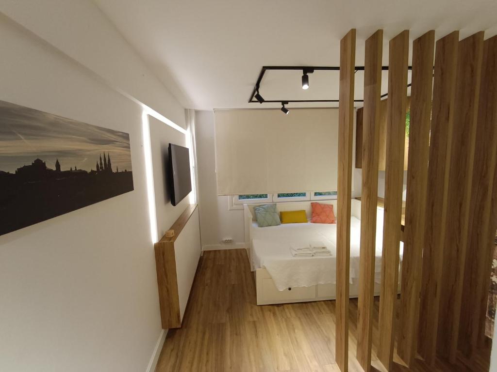 Postel nebo postele na pokoji v ubytování Precioso loft a 600m de la catedral