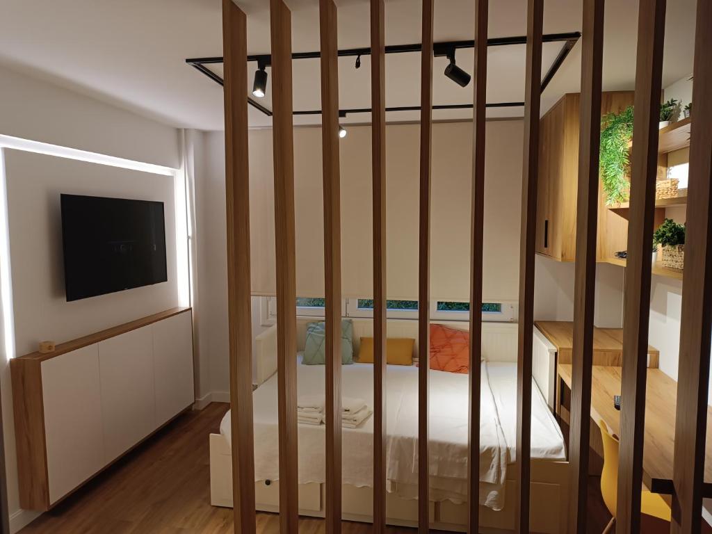 Postel nebo postele na pokoji v ubytování Precioso loft a 600m de la catedral