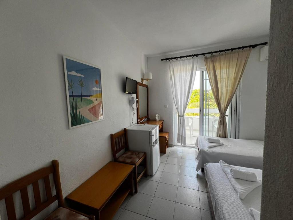Postel nebo postele na pokoji v ubytování Hotel Proteas