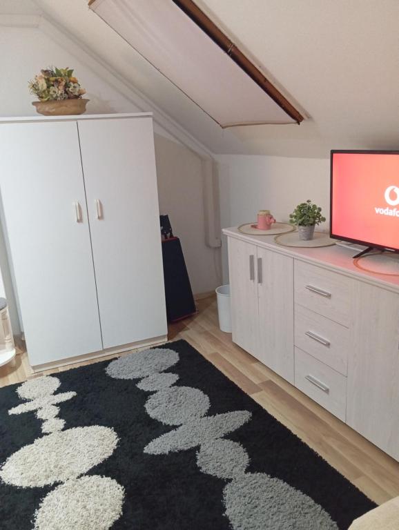 TV a/nebo společenská místnost v ubytování Gabi apartman