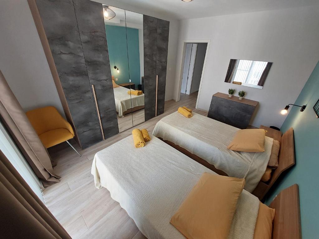 Postel nebo postele na pokoji v ubytování Serenity Apartment