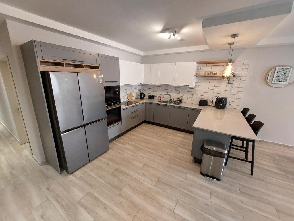 Kuchyň nebo kuchyňský kout v ubytování Serenity Apartment