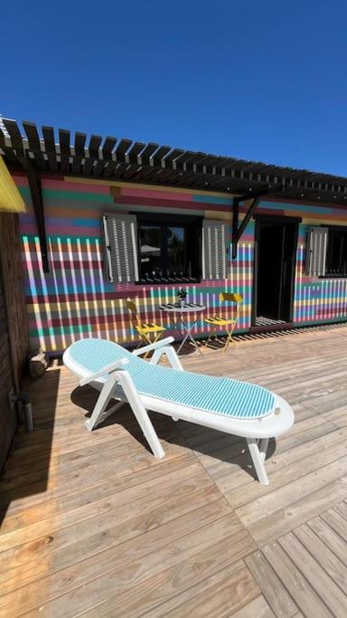 a bench on the deck of a house at La Casita in Cuartillos