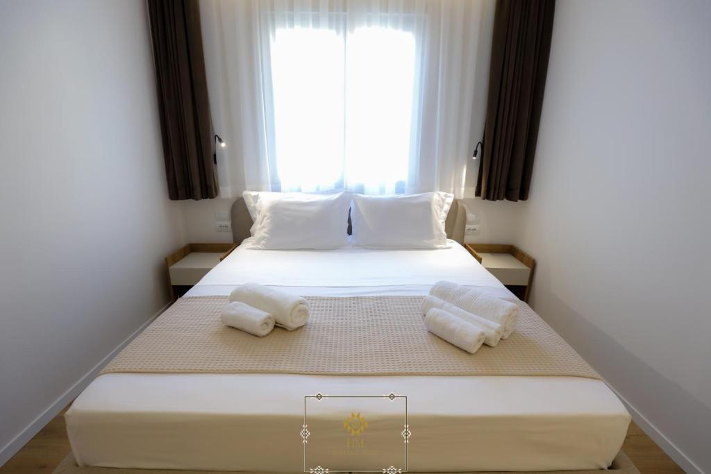 Postel nebo postele na pokoji v ubytování HM Boutique Hotel