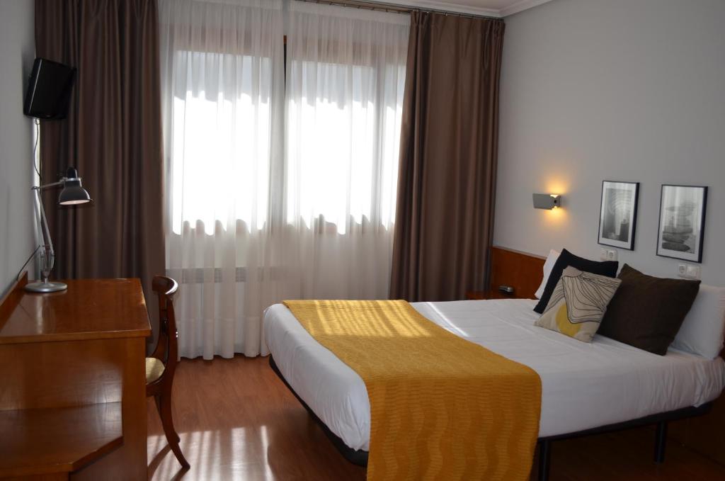 Postel nebo postele na pokoji v ubytování Hotel Elorrio