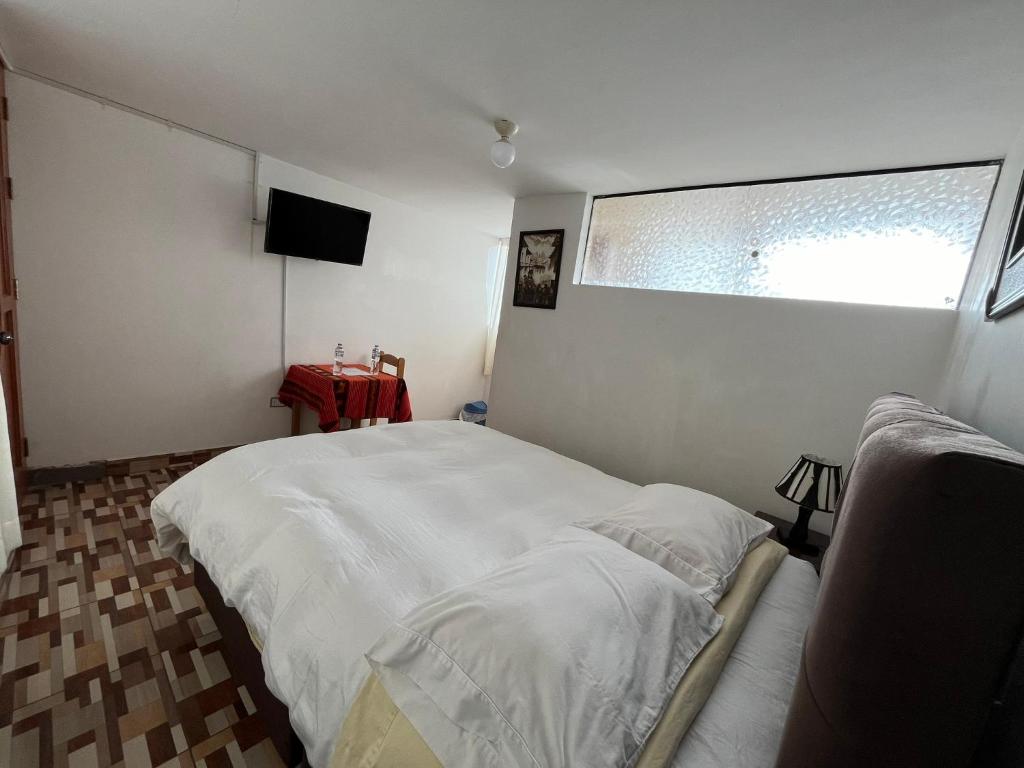 TV a/nebo společenská místnost v ubytování Hostal Apu Qhawarina