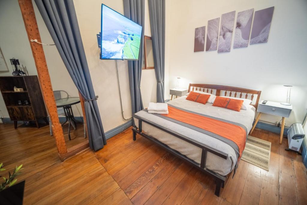Postel nebo postele na pokoji v ubytování Maki Hostels & Suites Valparaiso