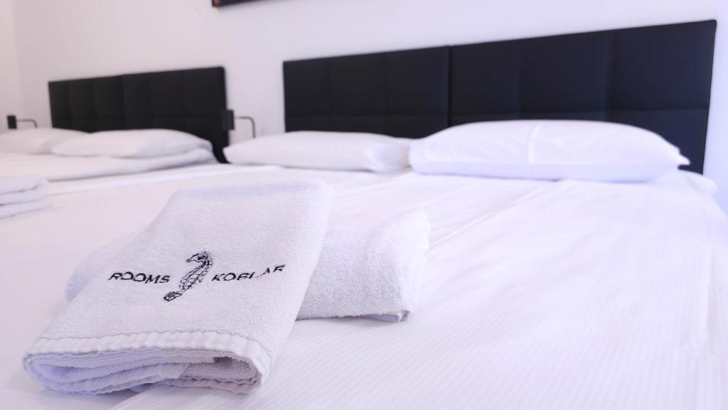 Postel nebo postele na pokoji v ubytování Rooms Koblar