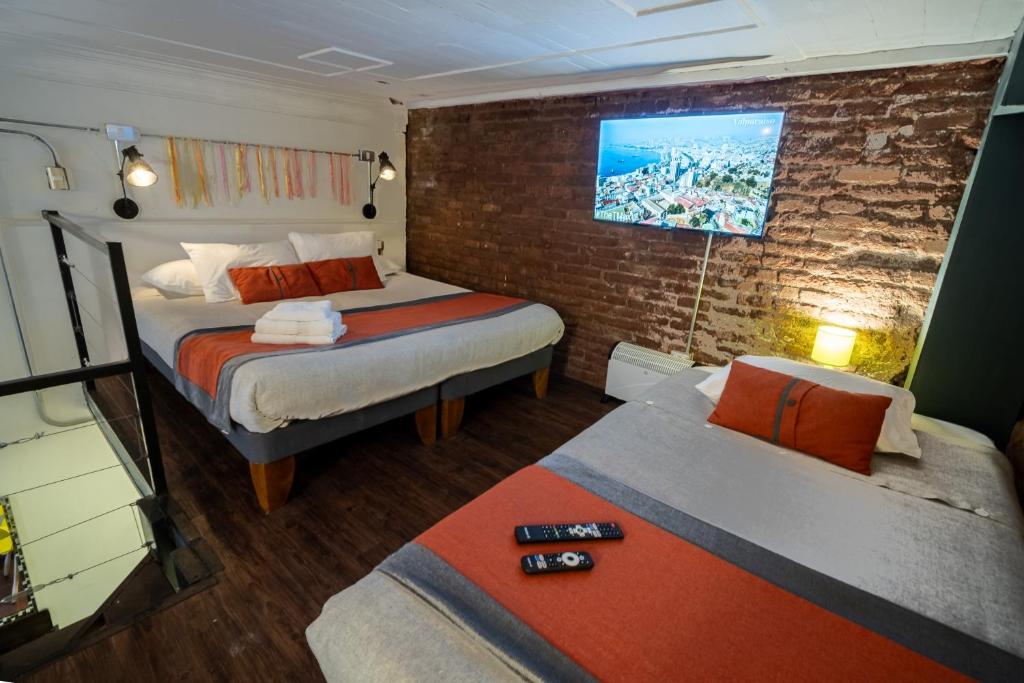 Postel nebo postele na pokoji v ubytování Maki Hostels & Suites Valparaiso