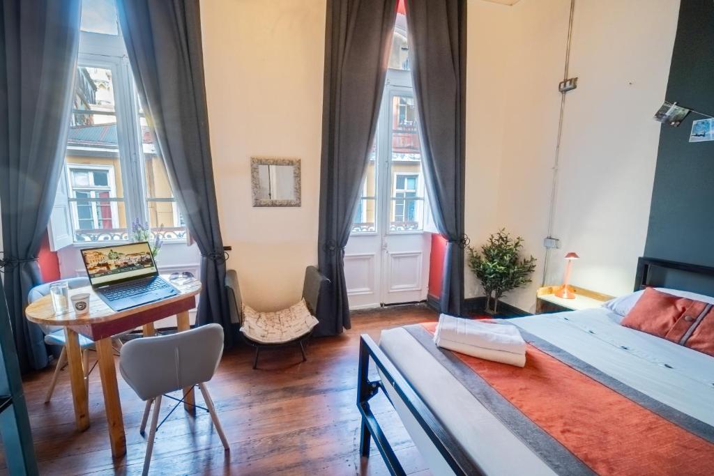 Postel nebo postele na pokoji v ubytování Maki Hostels & Suites Valparaiso