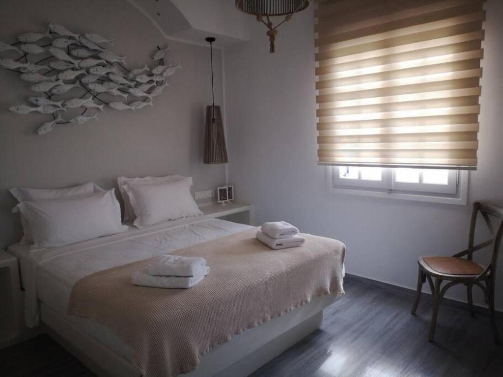 Posteľ alebo postele v izbe v ubytovaní Naxos Kastraki Boutique House With MVigla Seaview