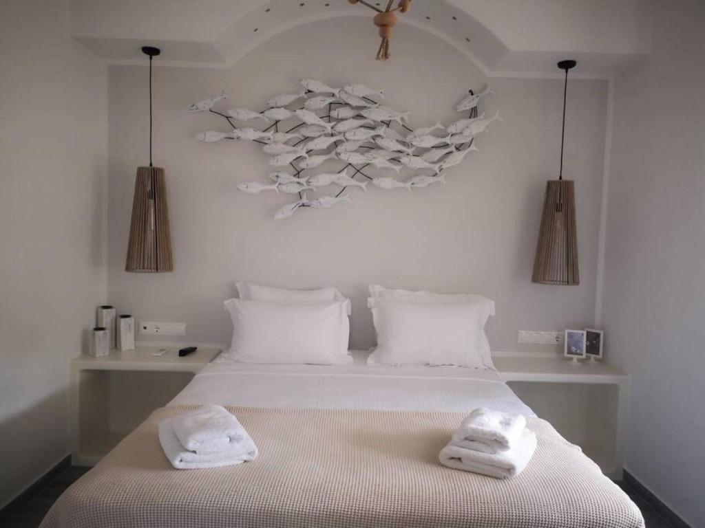 Posteľ alebo postele v izbe v ubytovaní Naxos Kastraki Boutique House With MVigla Seaview