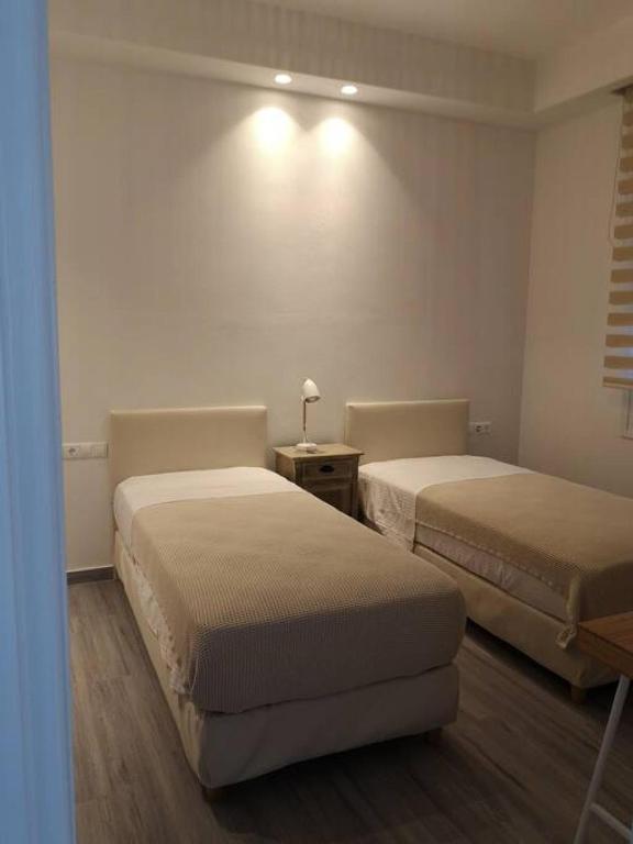 Posteľ alebo postele v izbe v ubytovaní Naxos Kastraki Boutique House With MVigla Seaview