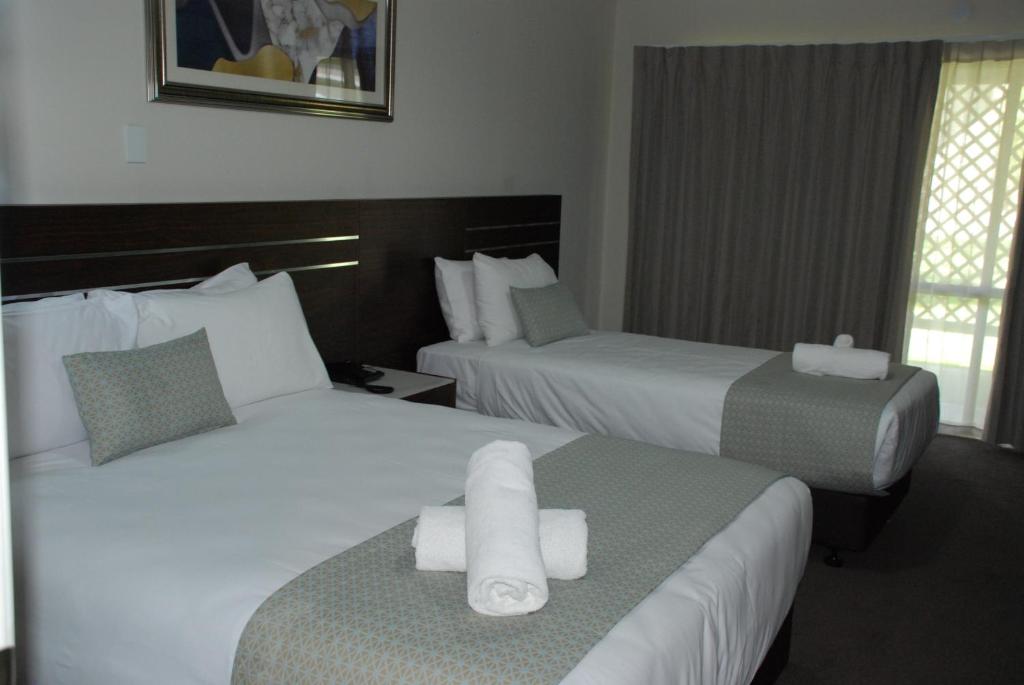 Postel nebo postele na pokoji v ubytování Auckland Airport Kiwi Motel