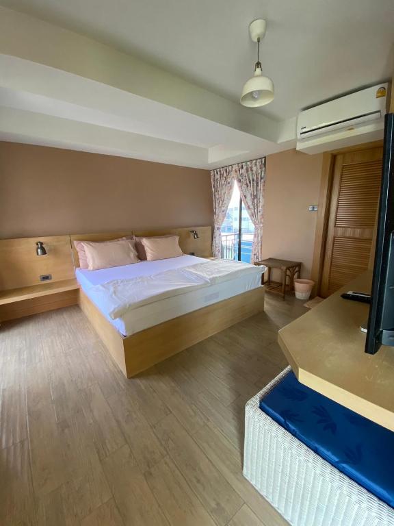 Postel nebo postele na pokoji v ubytování Huahin Place Guest House