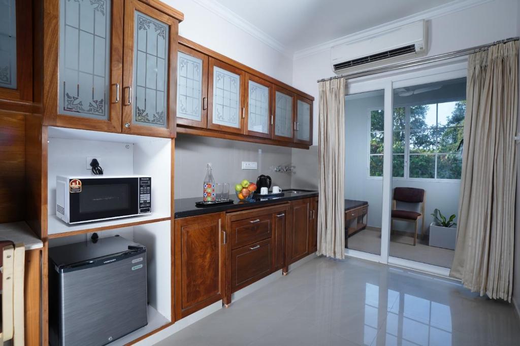Kuchyň nebo kuchyňský kout v ubytování TGR SUITES