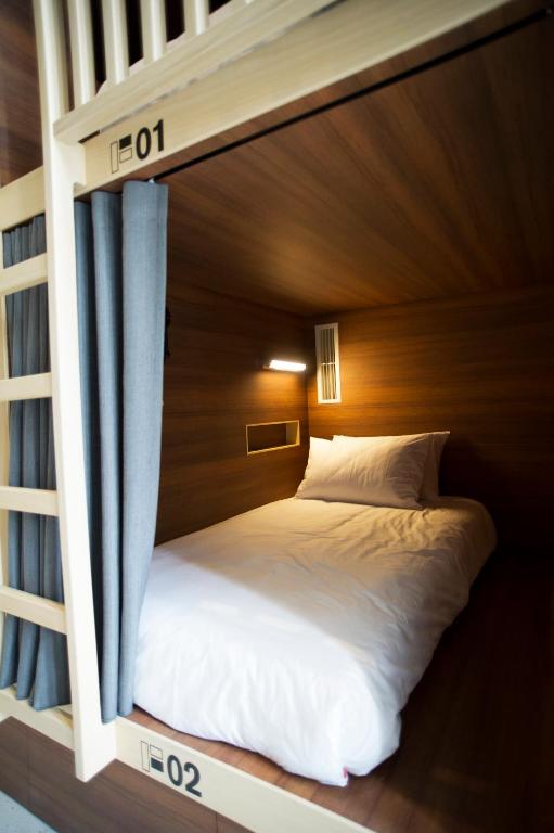 Postel nebo postele na pokoji v ubytování FFF Hotel