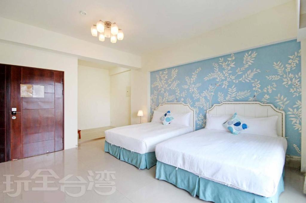 Postel nebo postele na pokoji v ubytování Dibao 16 Homestay