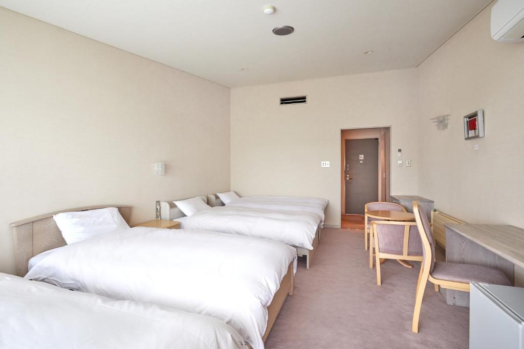 Postel nebo postele na pokoji v ubytování IKOI Villa