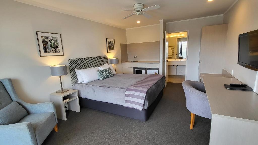 Postel nebo postele na pokoji v ubytování Manukau Motor Lodge