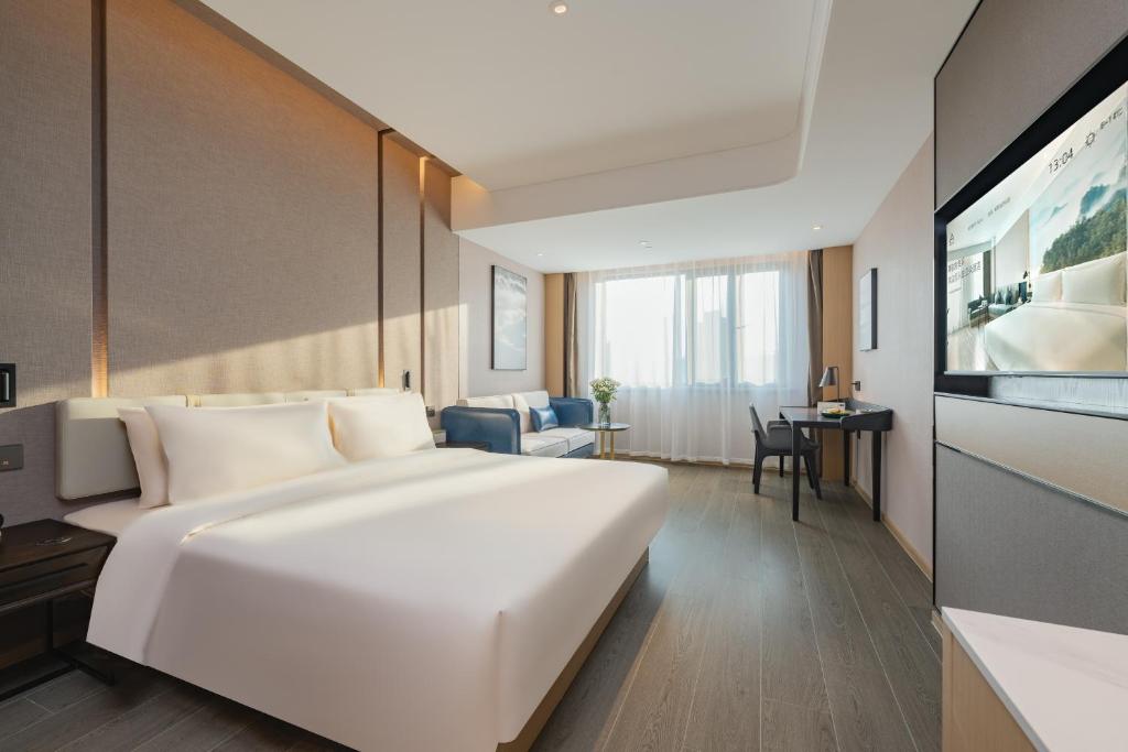 Postel nebo postele na pokoji v ubytování Atour Hotel Shanghai Jiading Juyuan Wisdom Center