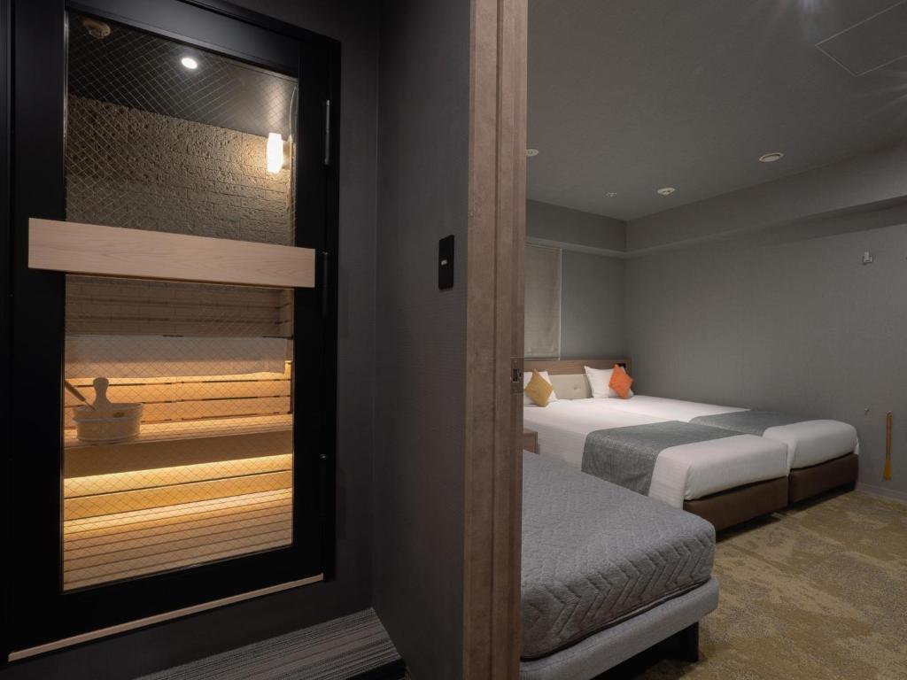 Katil atau katil-katil dalam bilik di Hotel Villa Fontaine Tokyo-Shinjuku