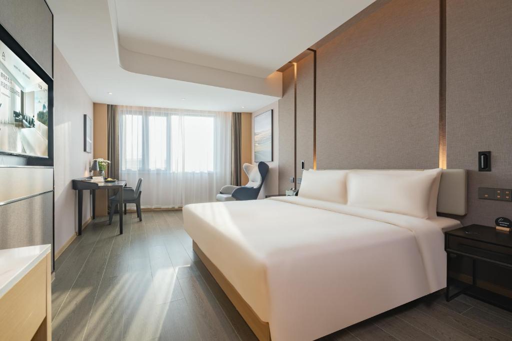 Postel nebo postele na pokoji v ubytování Atour Hotel Shanghai Jiading Juyuan Wisdom Center
