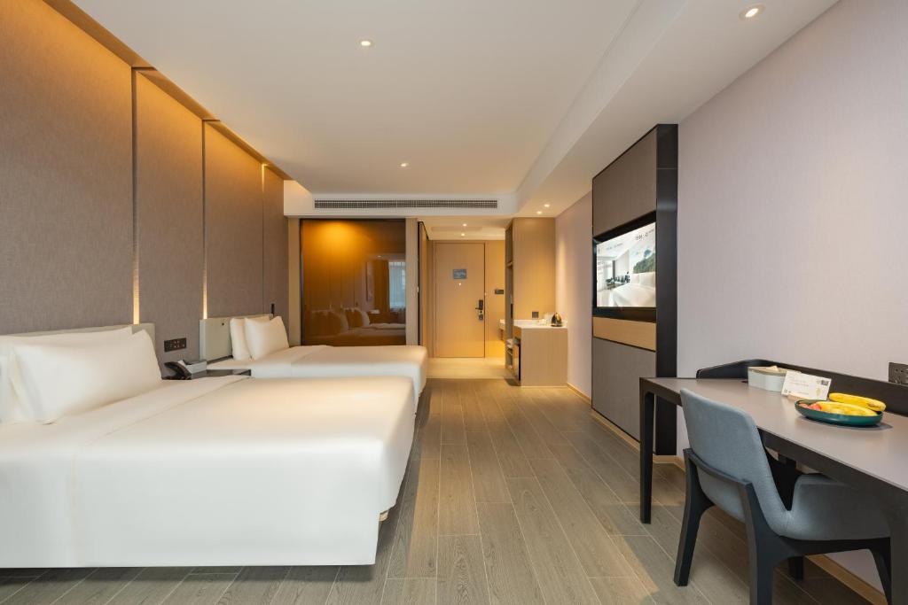 Postel nebo postele na pokoji v ubytování Atour Hotel Shanghai Jiading Juyuan Wisdom Center